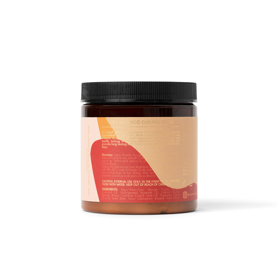 The back of As I Am Jamaican Black Castor Oil Curling Creme (227g) with a beige and pink label containing instructions and ingredient list.