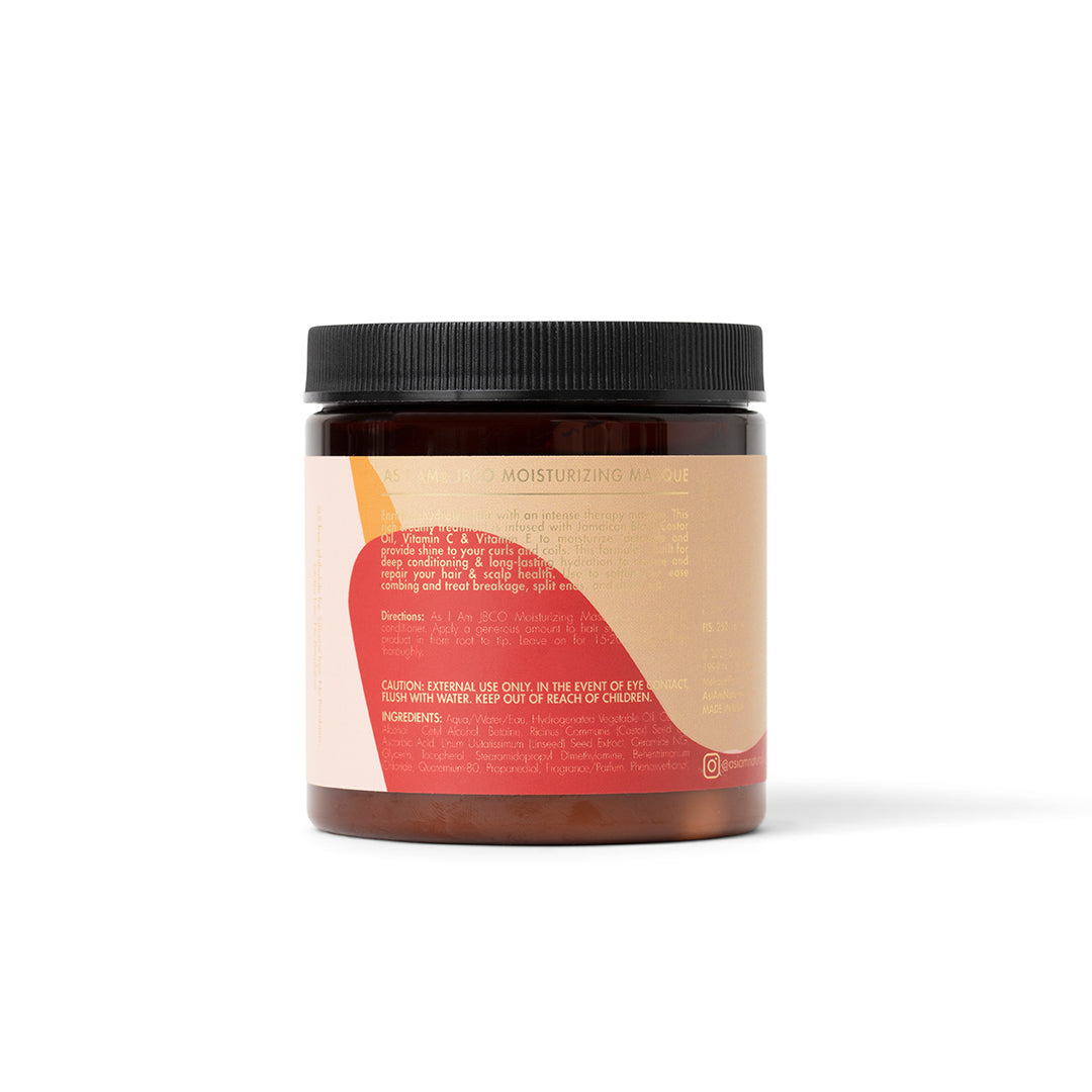 The back of an As I Am Jamaican Black Castor Oil Moisturizing Masque (227g) with a pink and beige label containing instructions and ingredient list.