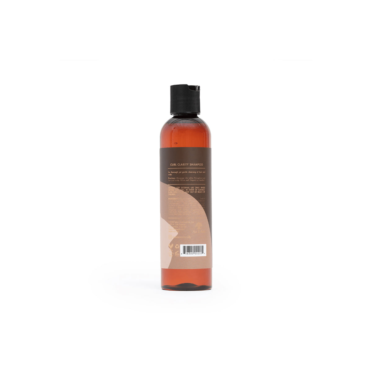 Back of a brown shampoo bottle with a white label. The bottle contains As I Am Curl Clarity Shampoo and shows the ingredient list and instructions for use