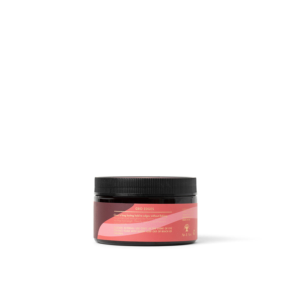 The side of a black jar of As I Am Long & Luxe GroEdges (113g) with a pink label showing the product name and part of the description.
