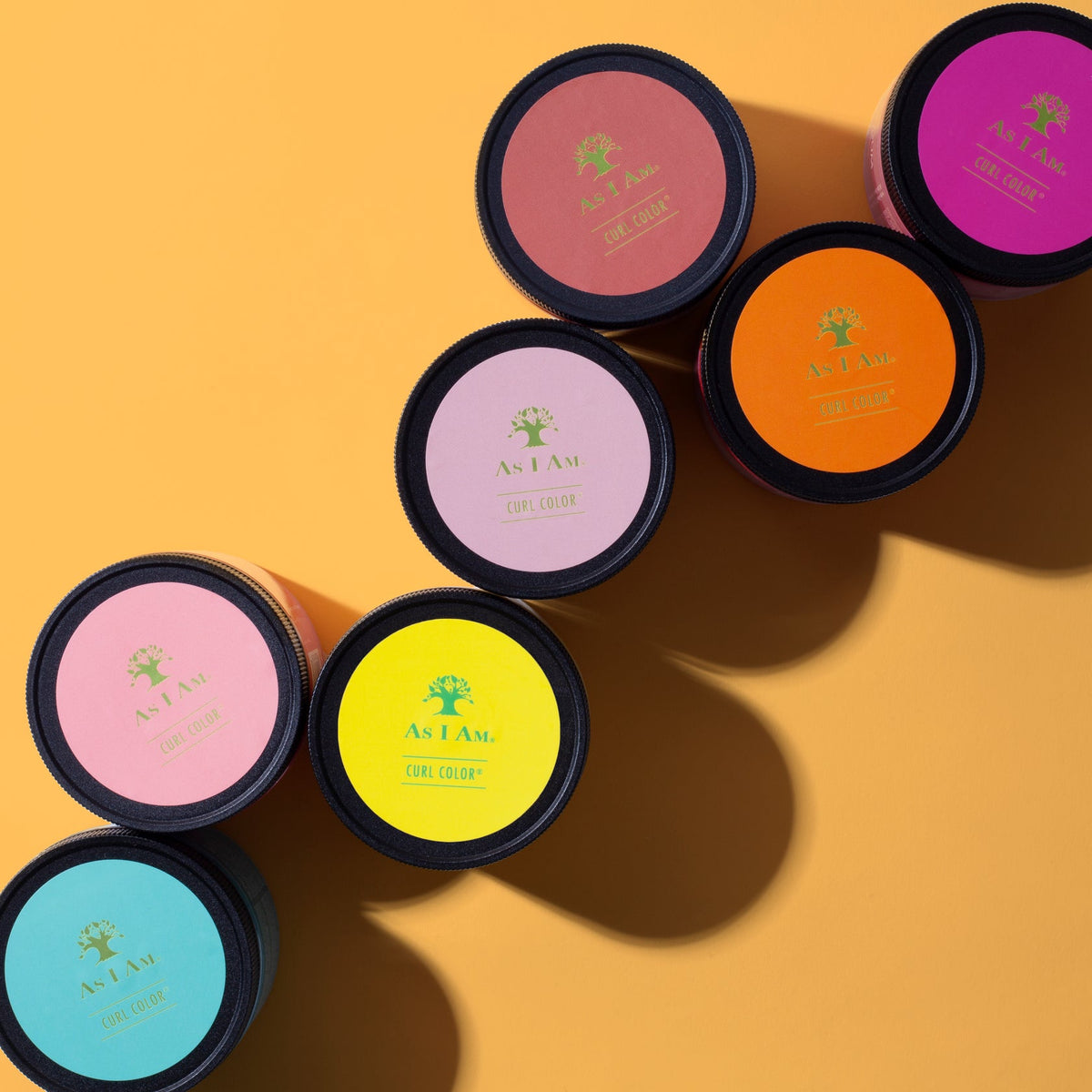 Image of a selection of As I Am Curl Color Temporary Color Gel in different colours, presented on an orange background.