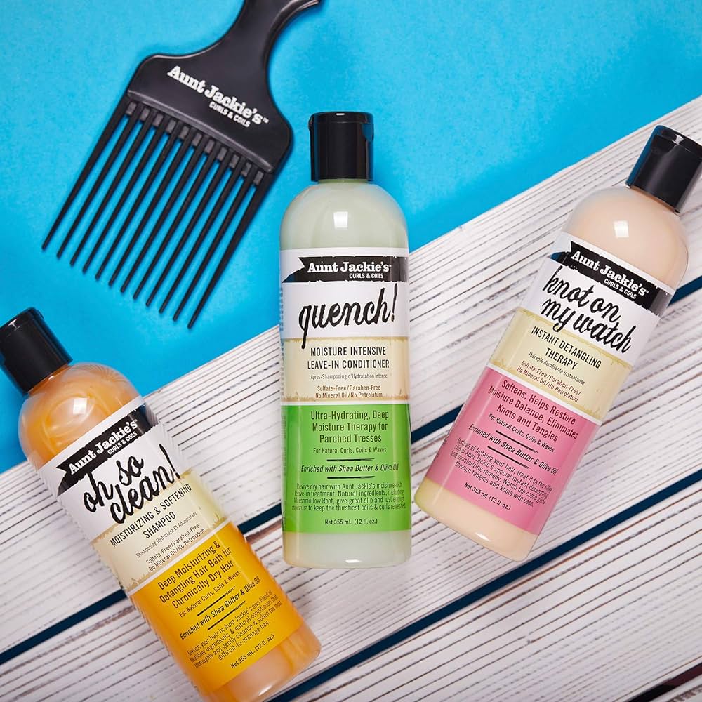 Aunt Jackie's hair care products: Quench Leave-In Conditioner, Oh So Clean Shampoo and Knot On My Watch detangler, along with a wide-toothed comb.