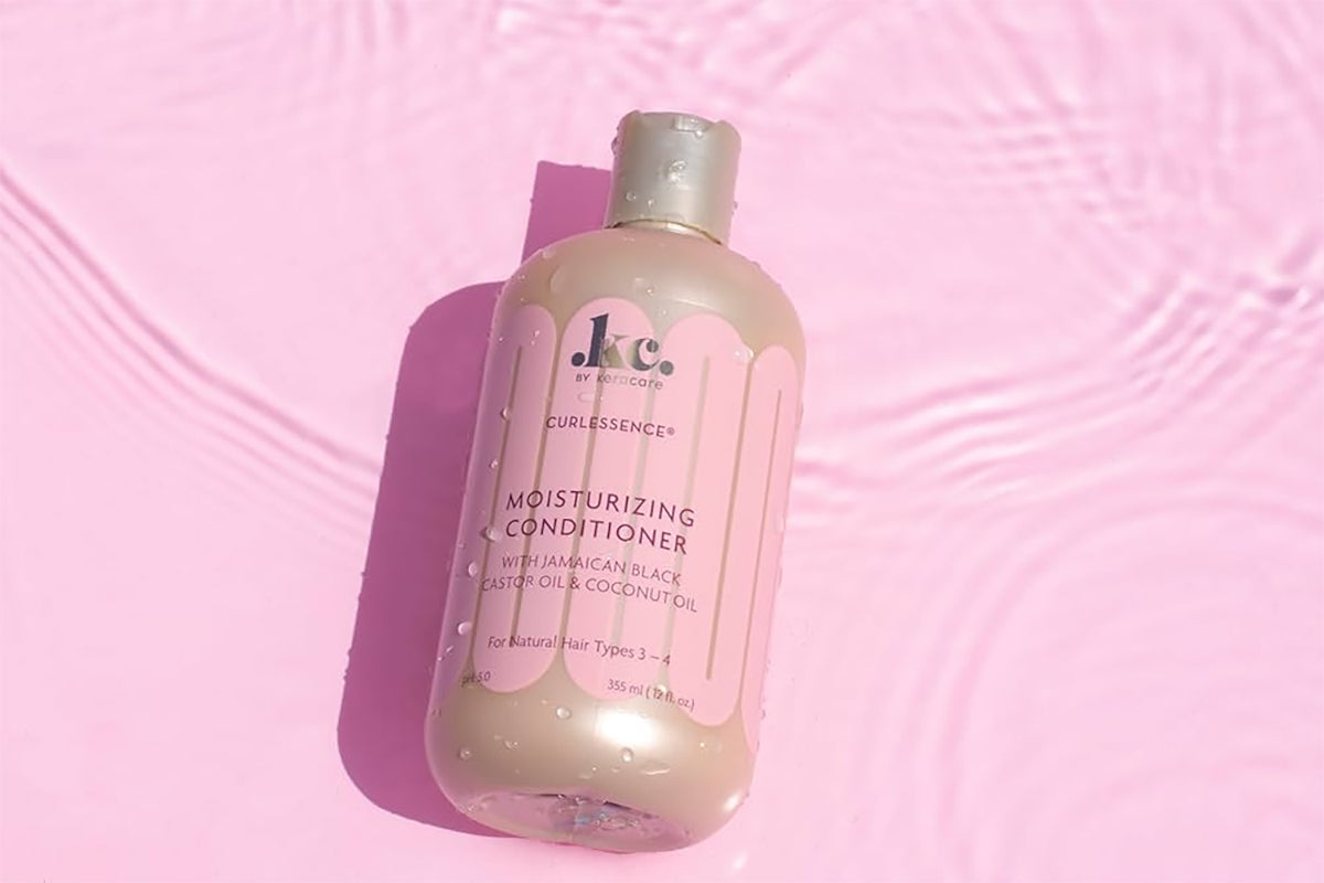 Bottle of Keracare Curlessence Moisturizing Conditioner with Jamaican black castor oil and coconut oil for natural hair types 3-4.