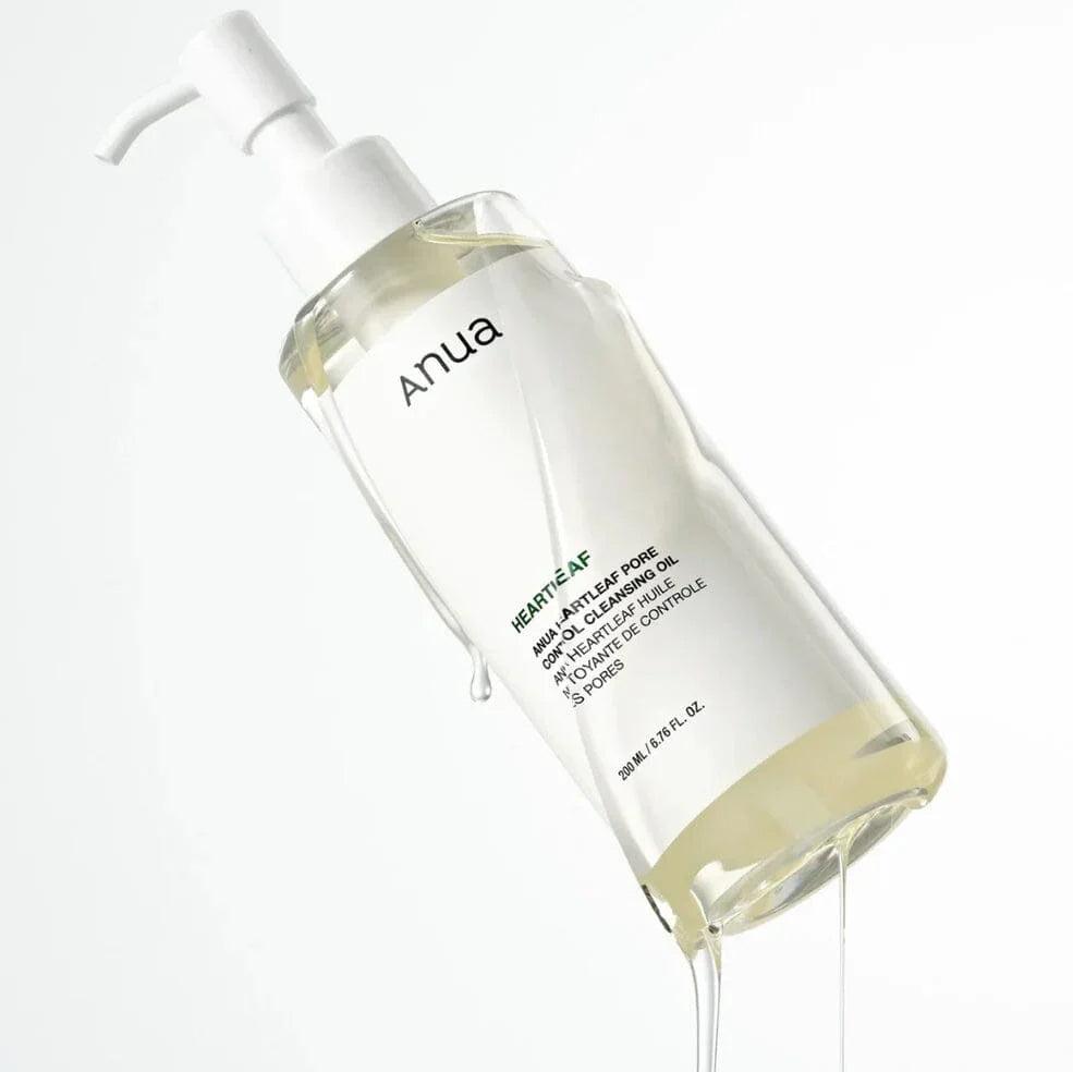 Anua Heartleaf Pore Control Cleansing Oil in transparent pump bottle with liquid oil on white background.