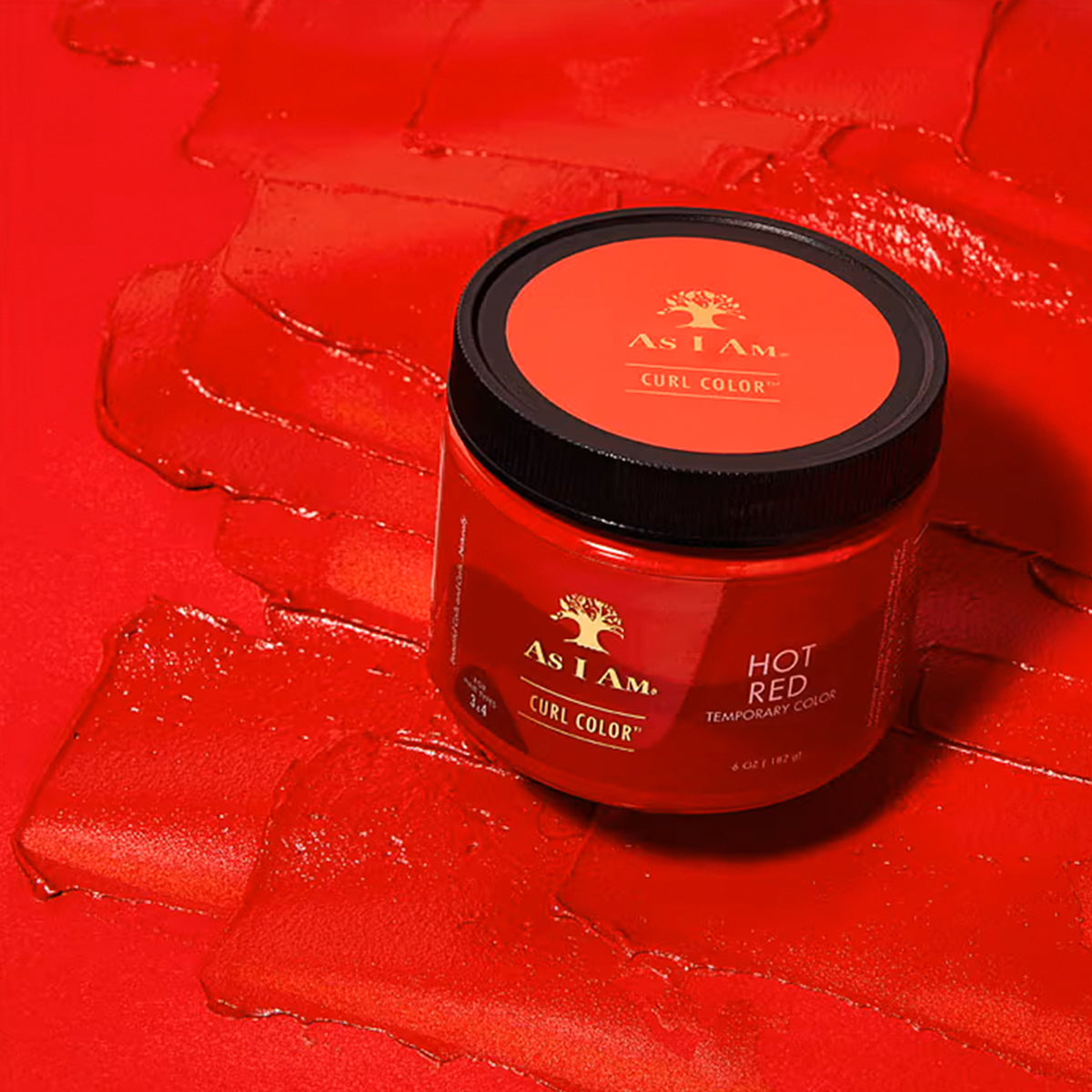 As I Am Curl Color Hot Red - red hair color gel on a red background.