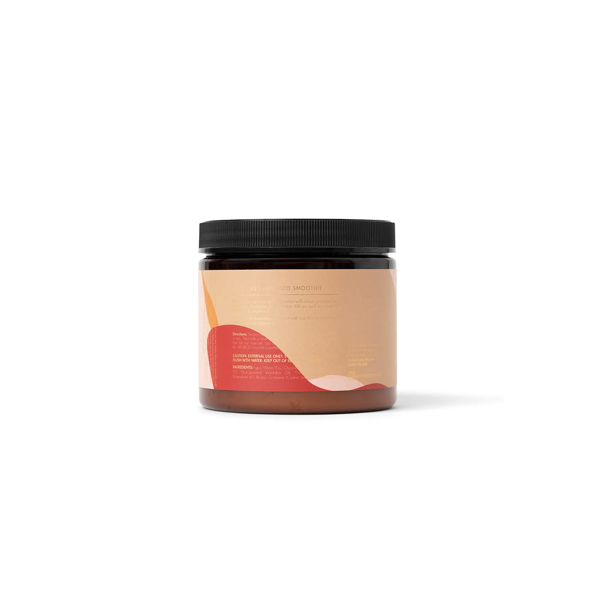 The back of a dark jar of As I Am Jamaican Black Castor Oil Smoothie (454g) with a pink and beige label containing ingredient list, directions for use and other product information.