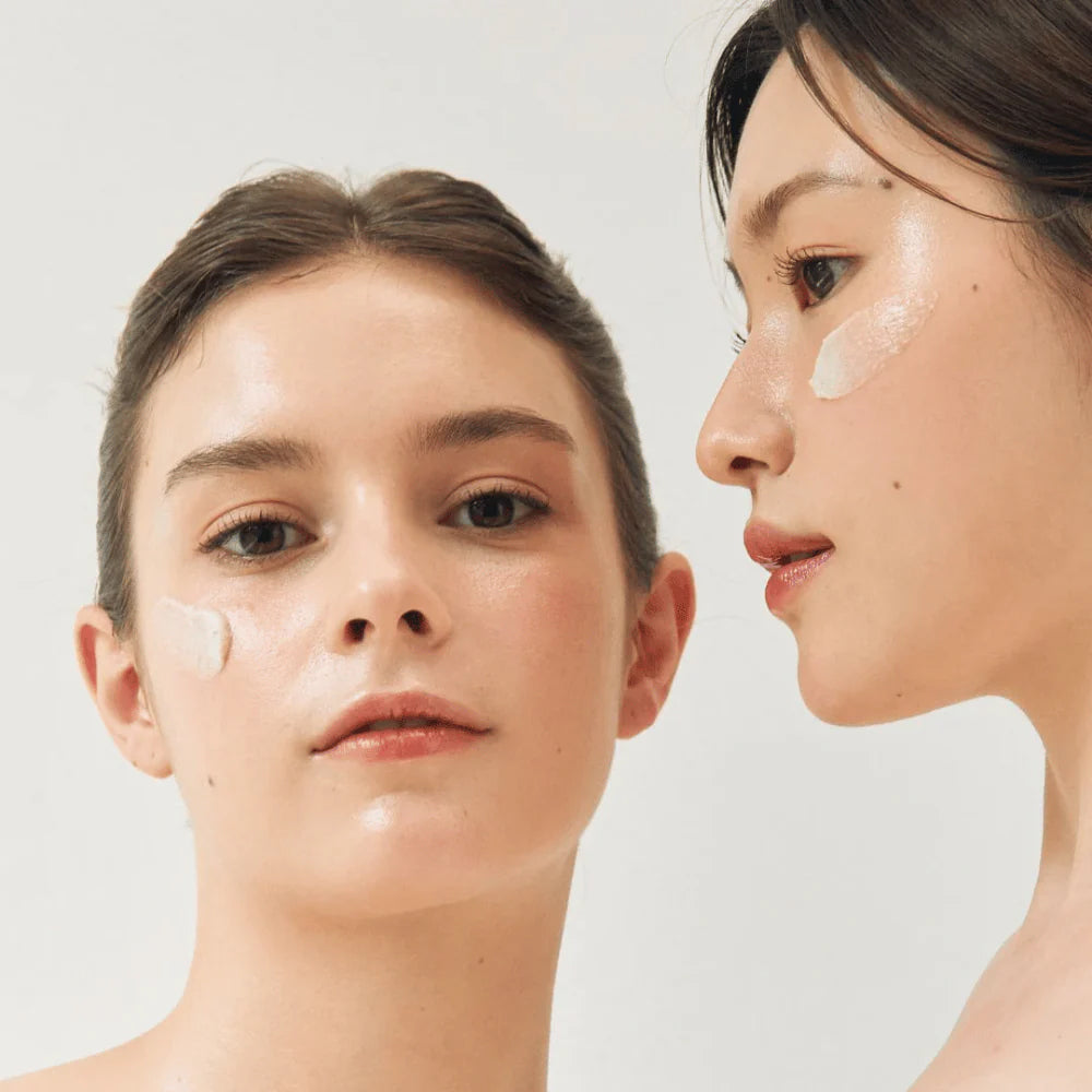 Two women with glowing skin and applied Beauty of Joseon Ground Rice and Honey Glow Mask 150ml in a light and clean setting.