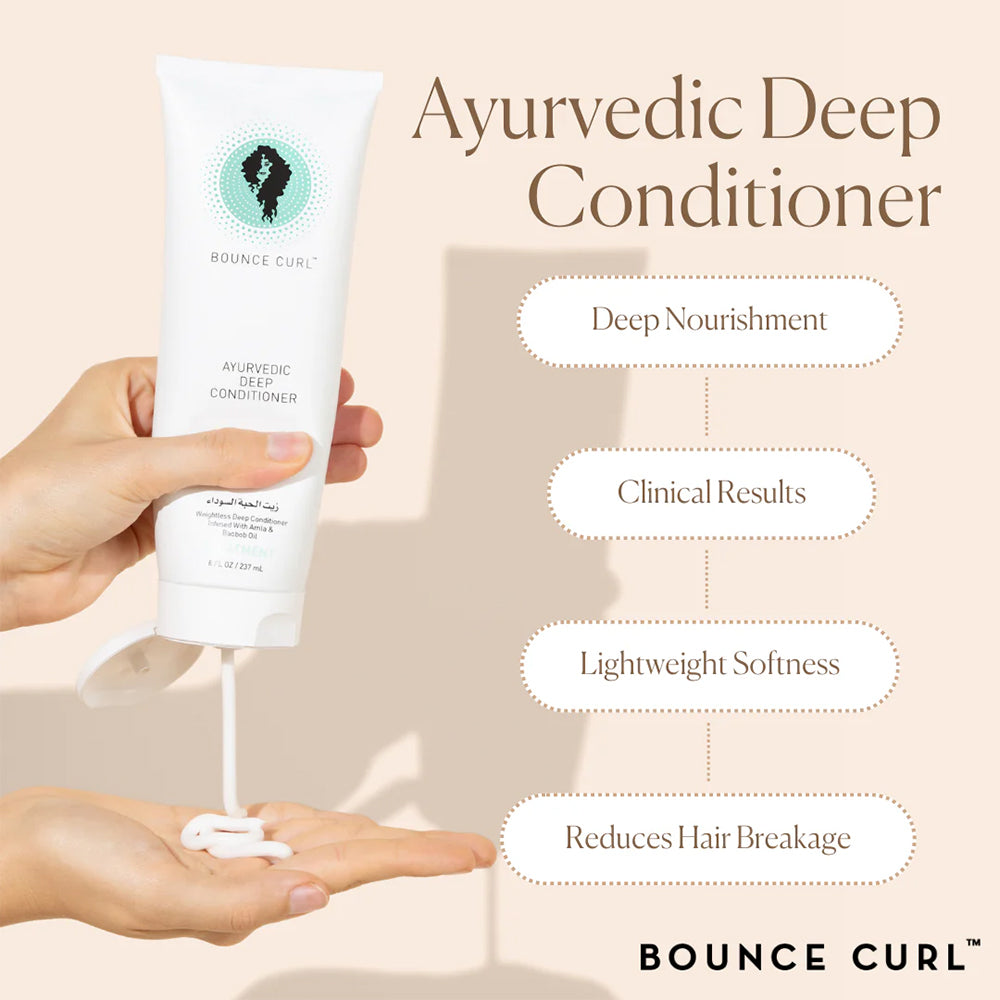 Bounce Curl Ayurvedic Deep Conditioner 237ml is squeezed out in the hand, with a focus on softness, nourishment and less hair breakage.