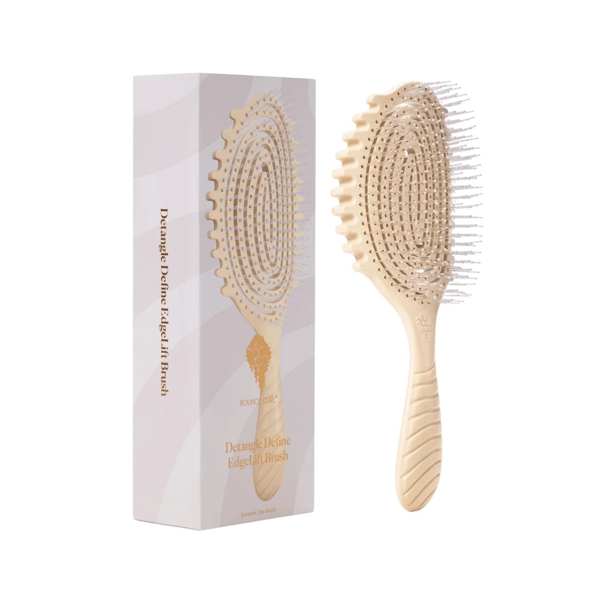 Bounce Curl Detangle Define EdgeLift Brush in cream with flexible teeth, shown next to the purple packaging.