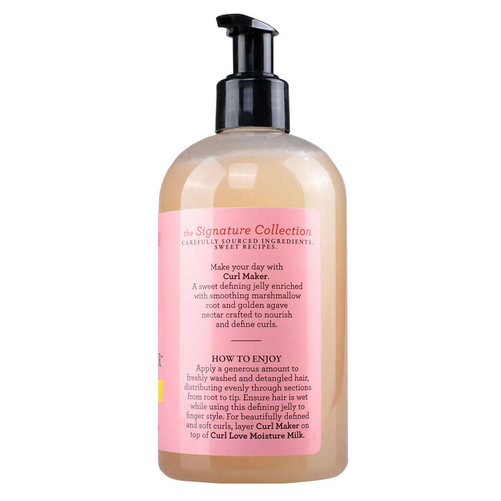 White plastic bottle with a black pump and pink cap. The bottle contains Camille Rose Curl Maker hair product.
