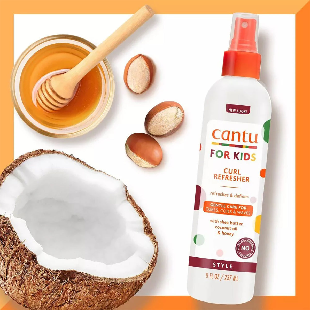 A white spray bottle with an orange top of Cantu For Kids Curl Refresher is placed next to illustrations of half a coconut, a bowl of honey and a honey spoon, as well as shea nuts.