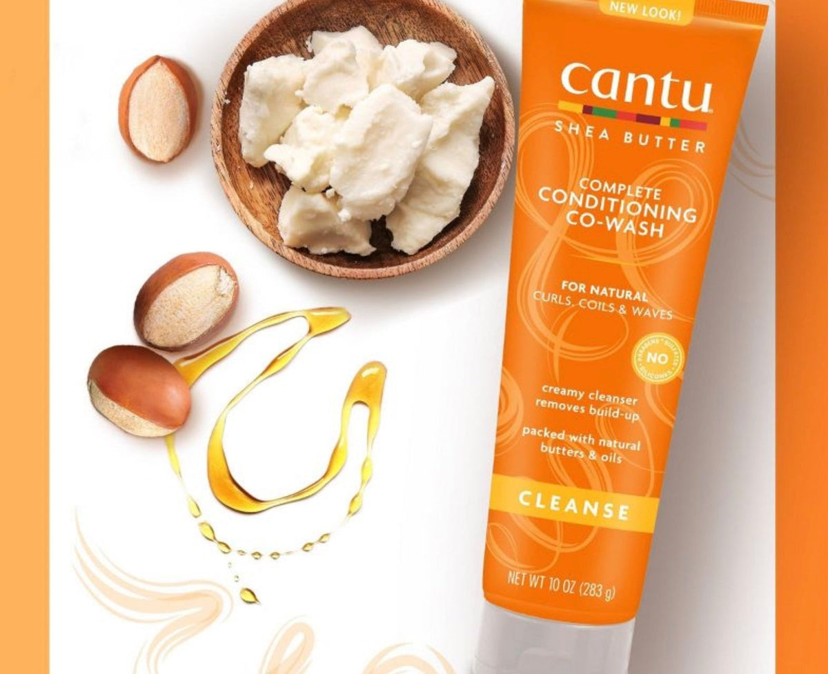 Cantu Shea Butter Complete Conditioning Co-Wash (283g) highlighted with shea nuts, shea butter and oils that illustrate the natural ingredients.