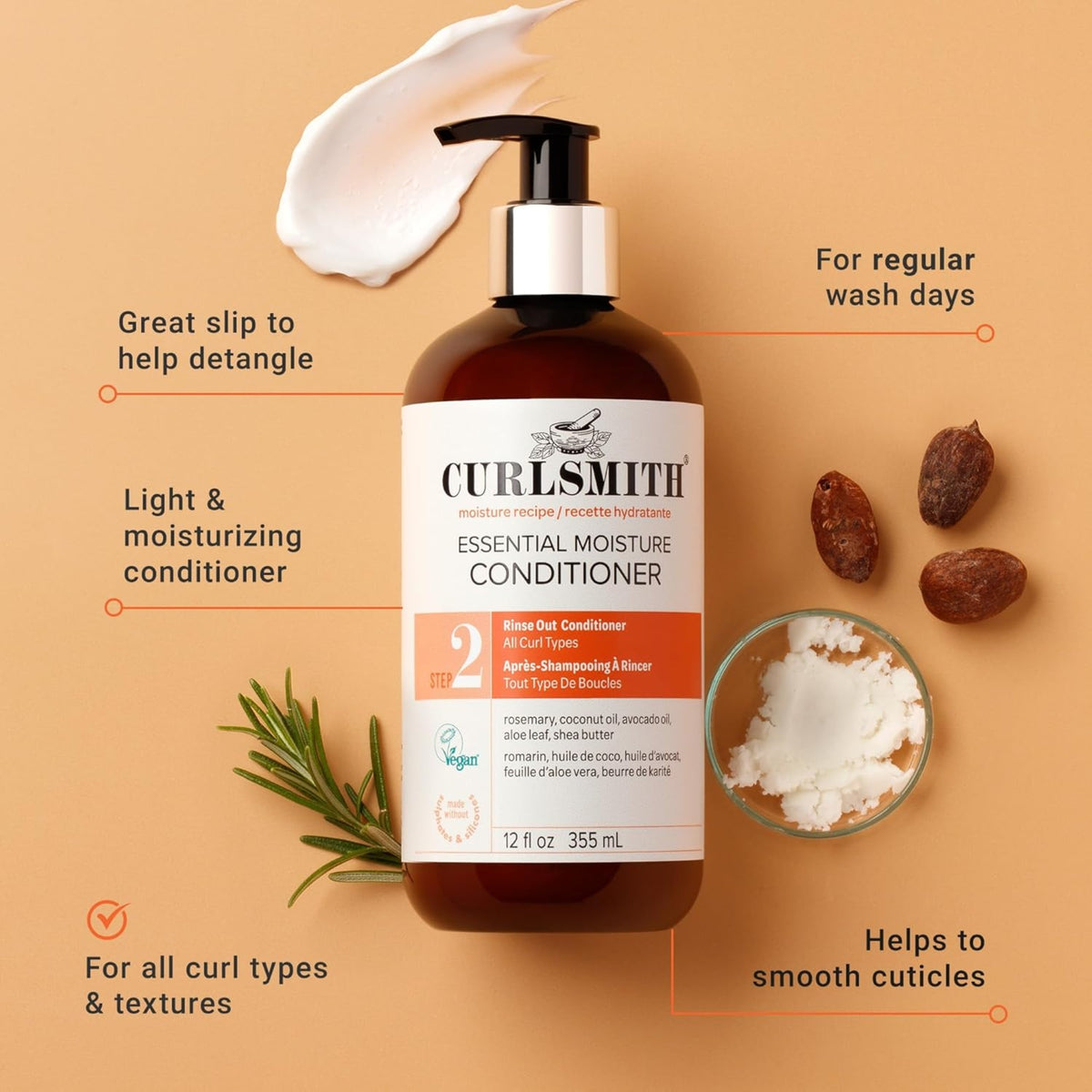 Curlsmith Essential Moisture Conditioner bottle with pump, surrounded by rosemary, shea butter and dried seeds on a beige background.
