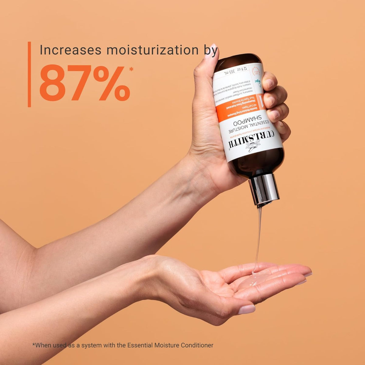 Curlsmith Essential Moisture Shampoo is poured into the hand, text shows 87% increased moisture in the hair.
