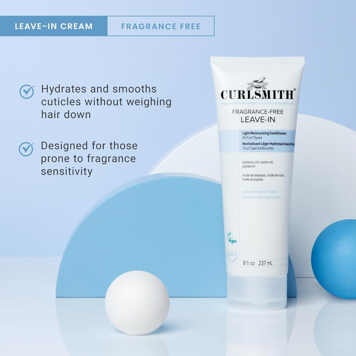 Curlsmith Fragrance-Free Leave-In cream in white tube, 237 ml, between blue and white decorative balls.