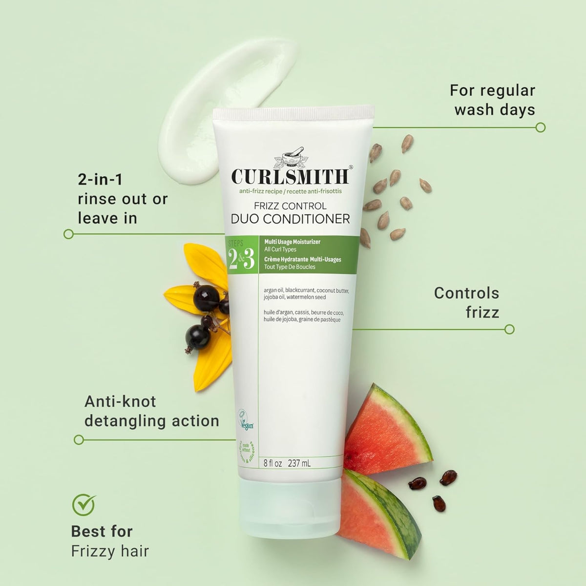 Curlsmith Frizz Control Duo Conditioner tube with cream, argan, currant, jojoba and watermelon seeds on a light green background.