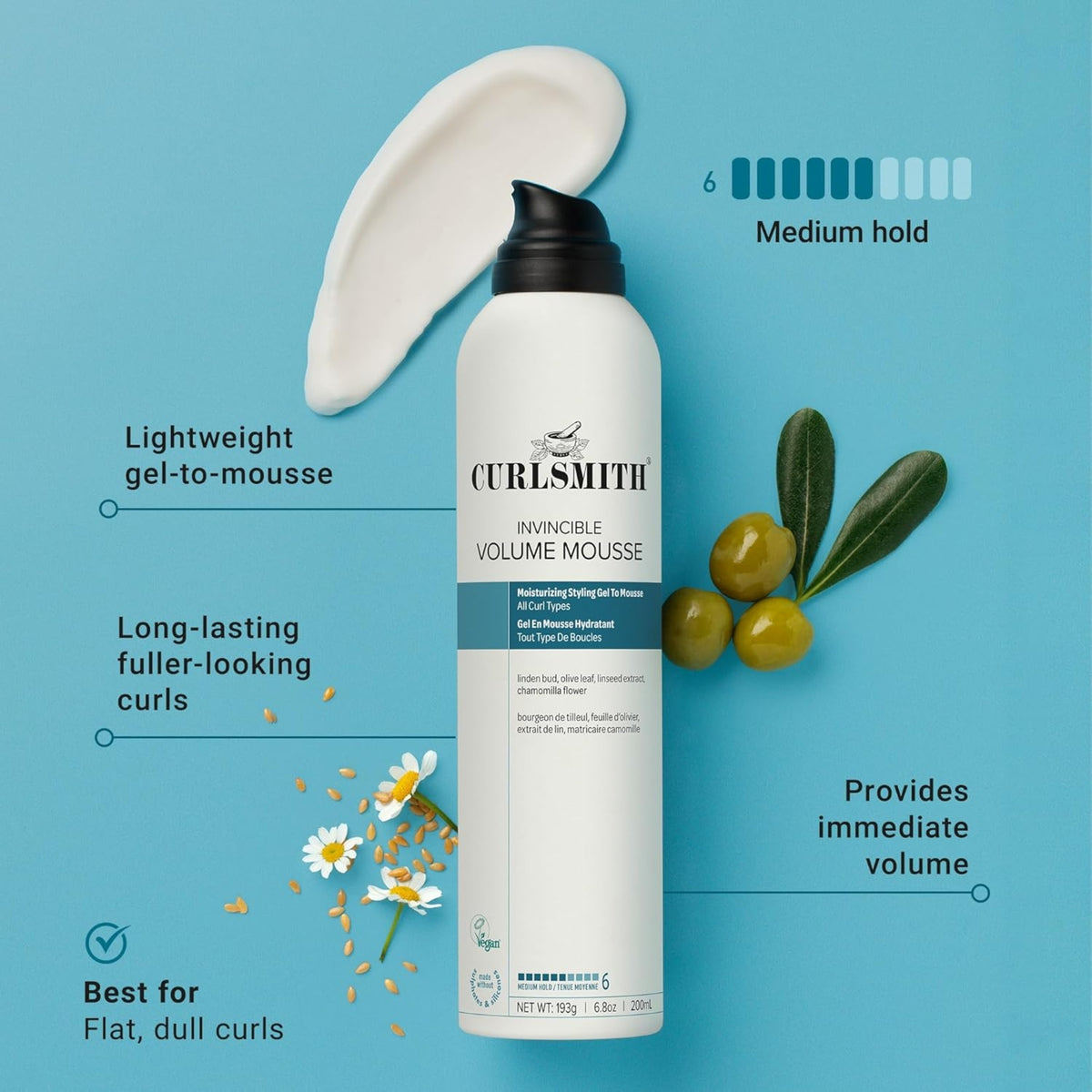 Curlsmith Invincible Volume Mousse in white bottle with black pump, surrounded by olive, chamomile and linseed on light blue background.