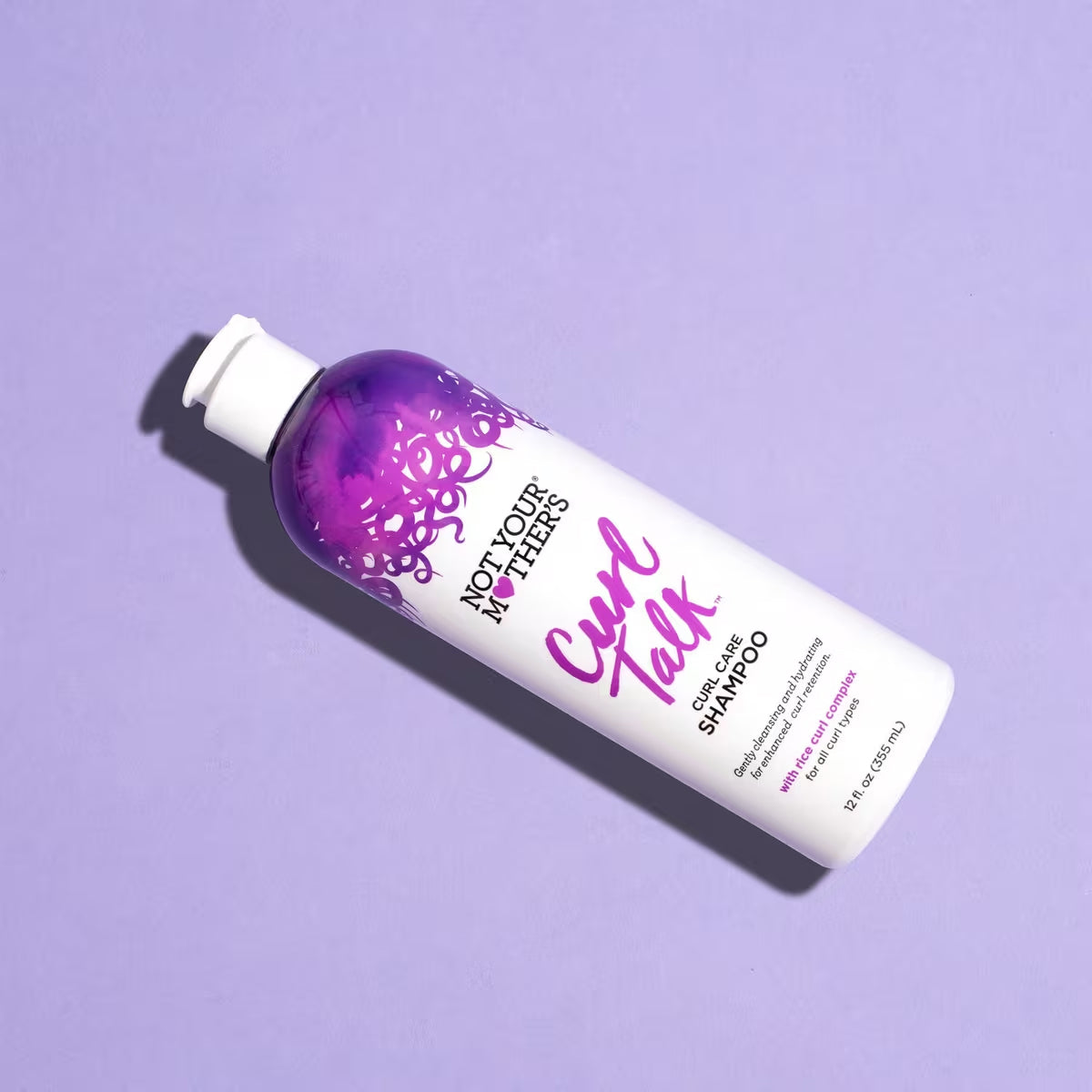 Product image of Not Your Mother's Curl Talk shampoo for curls set against a purple background, providing an alternative presentation.