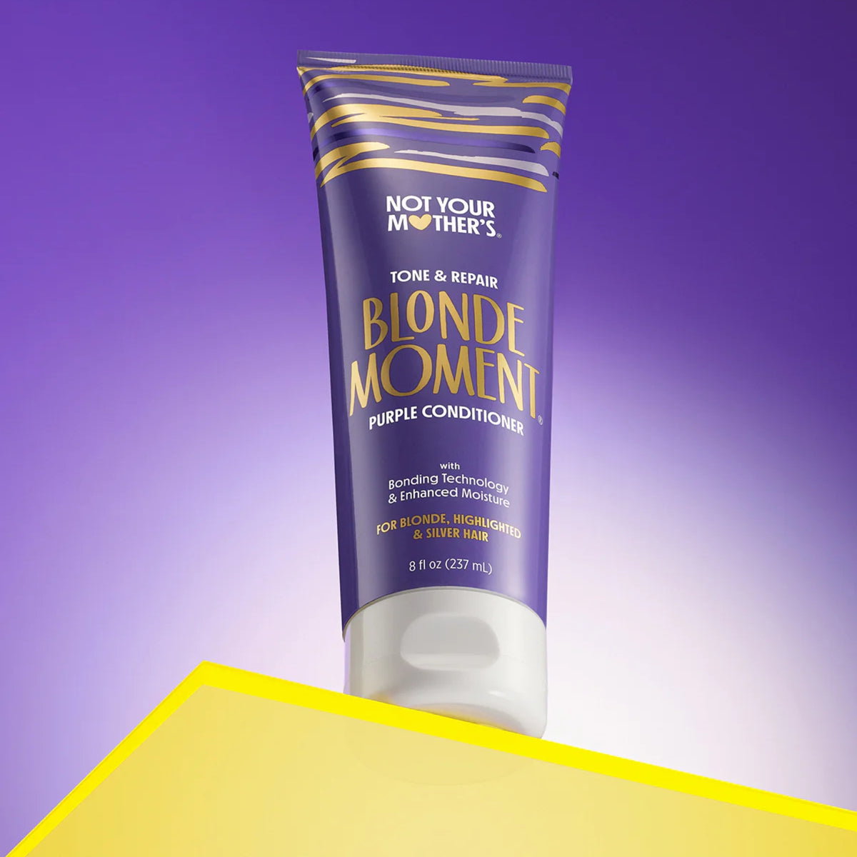 Not Your Mother's Blonde Moment purple conditioner in purple tube with gold, for blonde and silver colored hair.