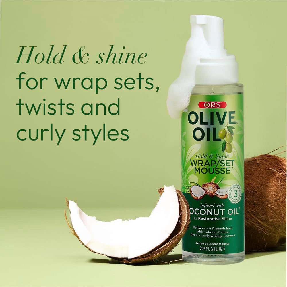 ORS Olive Oil Hold & Shine Wrap/Set Mousse (207 ml) for soft hold, volume, shine and defined curls. Contains coconut oil for replenishing shine. Image with coconut.
