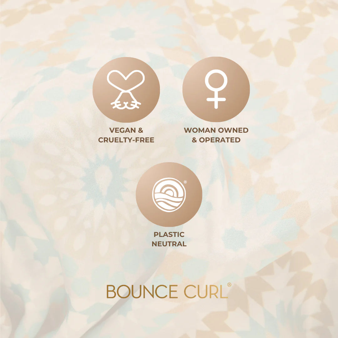 Pastel colored Bounce Curl Reversible Satin Hair Bonnet with icons for vegan, plastic neutral and women-owned production.