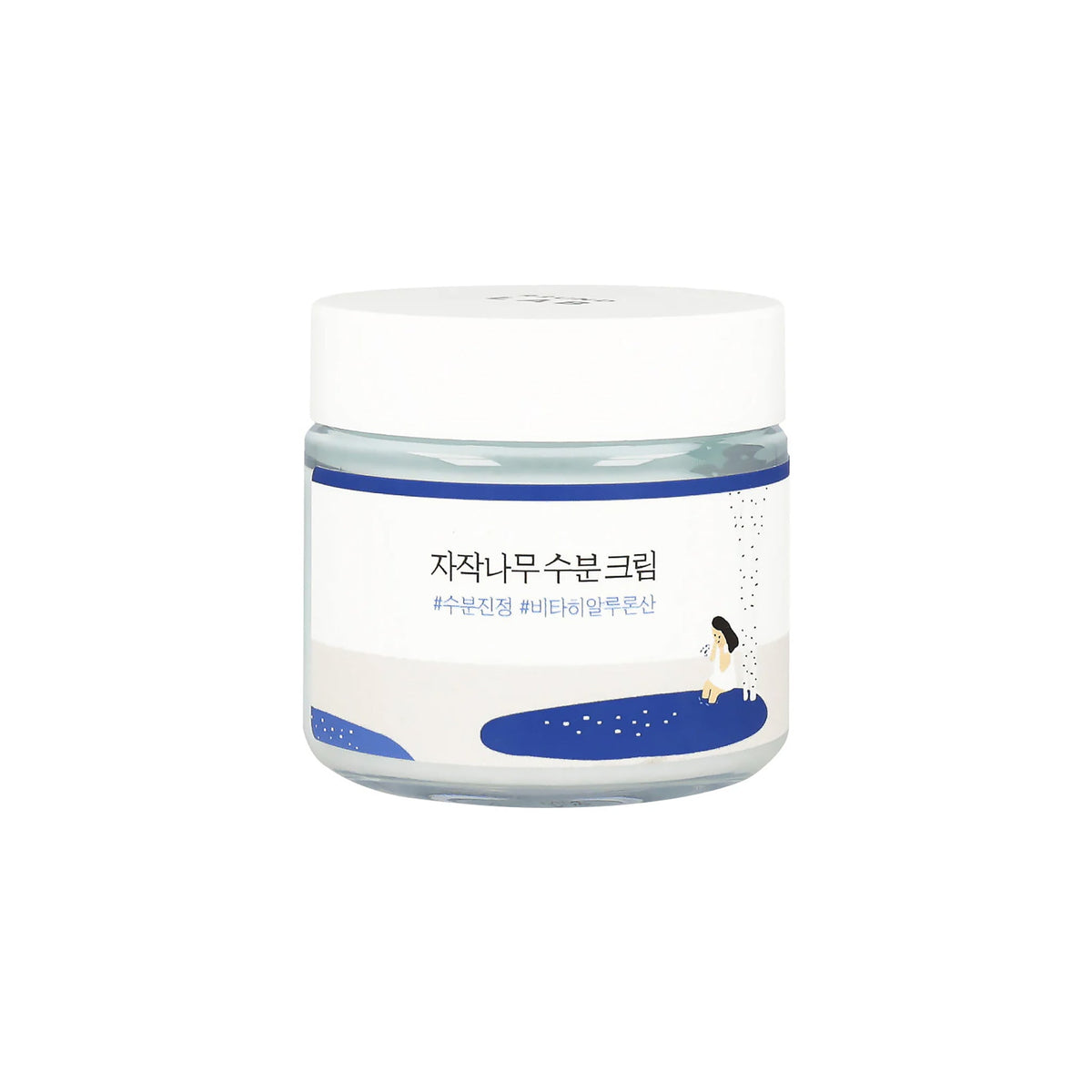 Frosted jar of *자작나무 나리 지리* birch water cream with blue and white design and illustration of woman by lake.