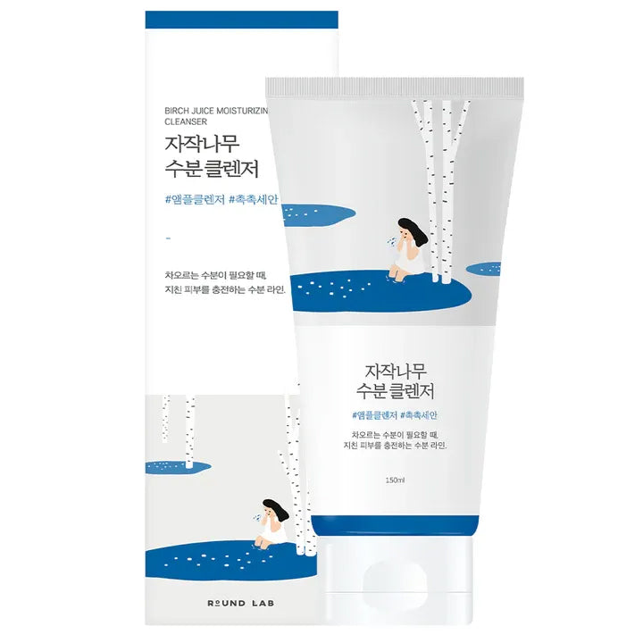 Round Lab Birch Juice Cleanser 150ml in white tube with blue lid and illustration of girl by birch trees, standing in front of accompanying box.