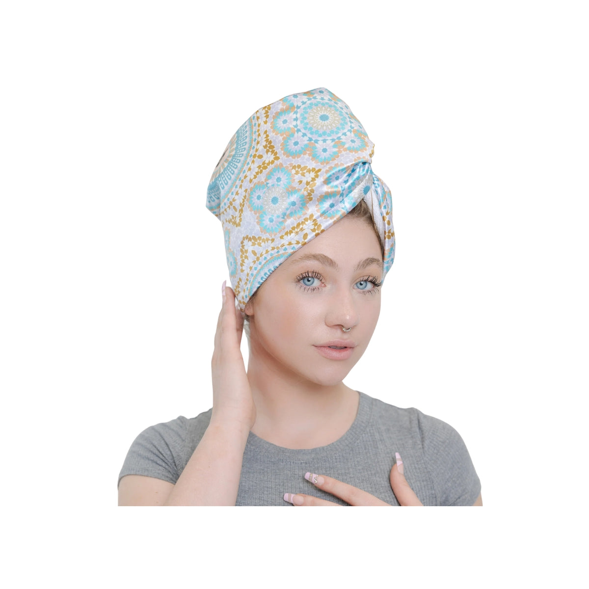 Woman wearing Bounce Curl Satin Microfiber Turban with colorful flower pattern in blue, white and golden color.
