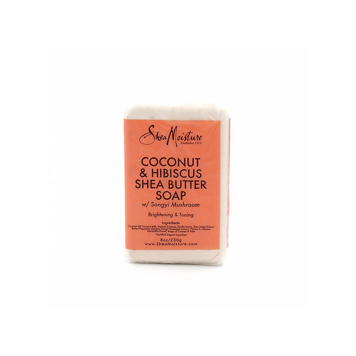 White bar of soap wrapped in beige/pink paper packaging with black and red text showing Shea Moisture Coconut & Hibiscus Shea Butter Soap (230g).