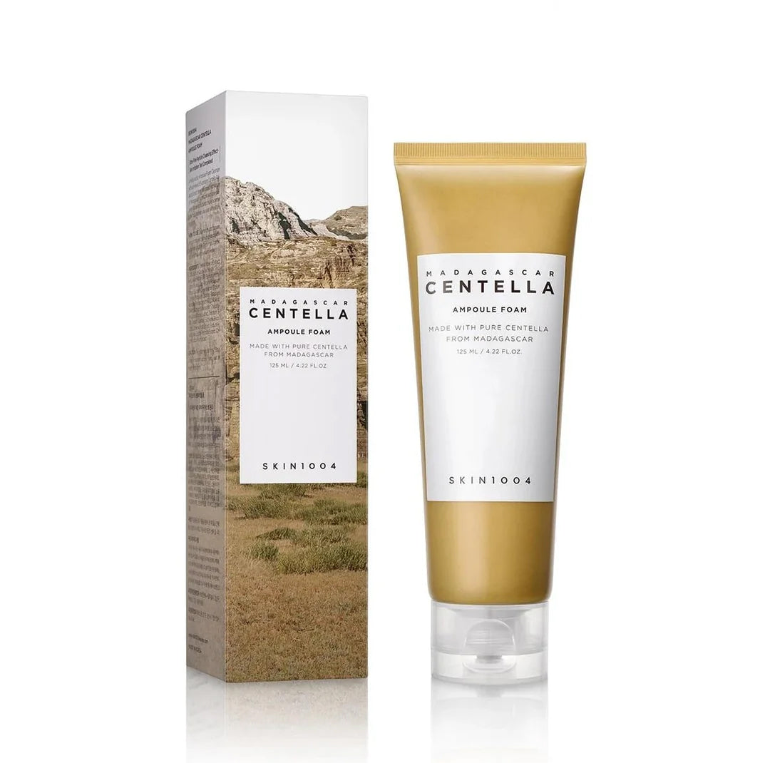 SKIN1004 Madagascar Centella Ampoule Foam 125ml in golden tube next to box with nature motif in brown and green shades.