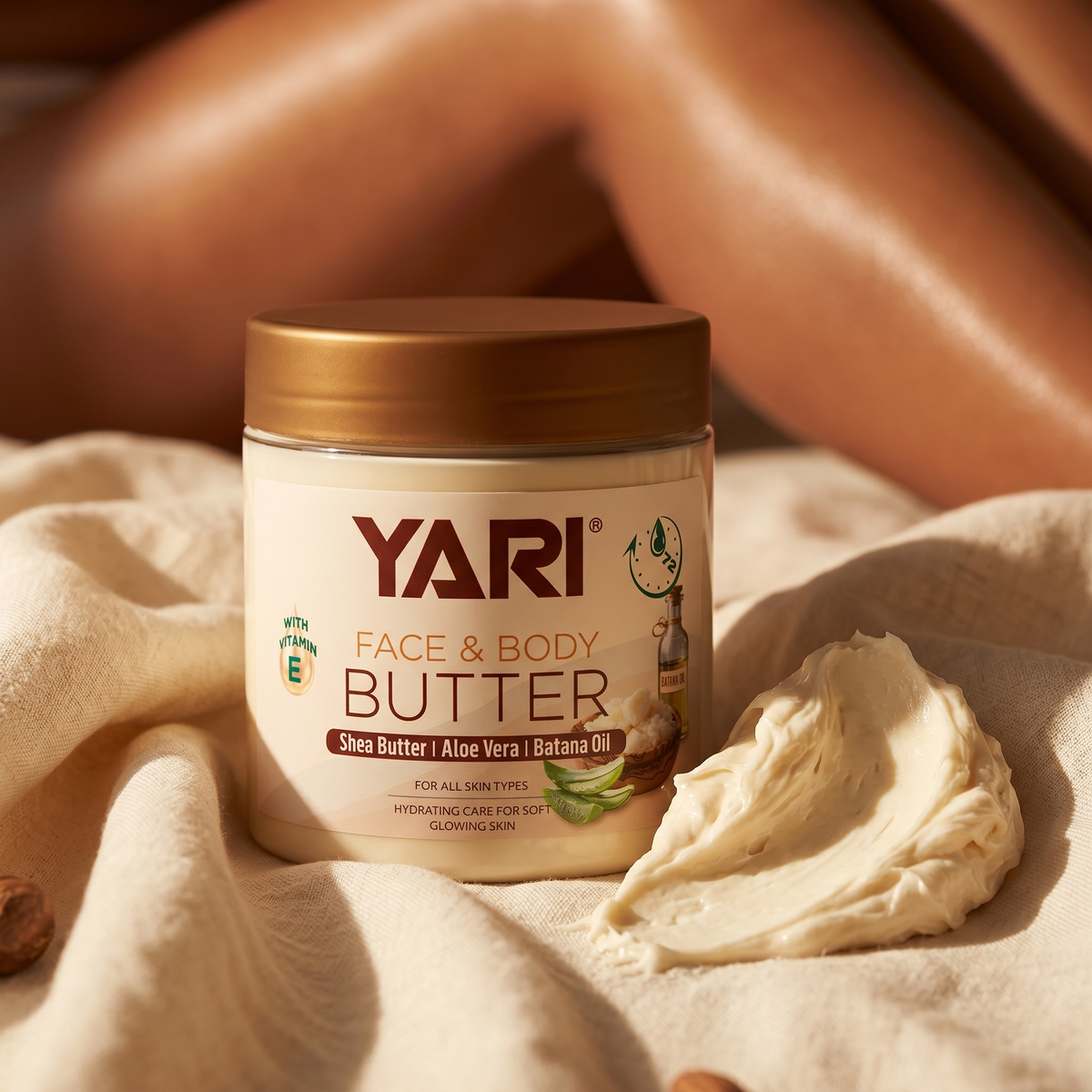 Yari Face & Body Butter with shea, aloe vera and batana oil in a jar on beige fabric with a splash of cream.